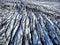 Aerial view of glacier from above, ice and ashes of the volcano texture landscape, beautiful nature ice background from Iceland