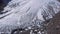 Aerial view of a glacier huge pieces of frozen ice and rock, top view. The glacier melts, the problems of ecology and