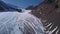 Aerial view of a glacier huge pieces of frozen ice and rock, top view. The glacier melts, the problems of ecology and