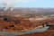 Aerial view of Glen Canyon Dam with Navajo Generating Station in the background