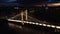 Aerial view of a glowing illuminated bridge at night in London, United Kingdom