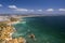 Aerial view of golden coast cliffs of portuguese southern beaches in Lagos City, Algarve, Portugal. Camilo beach and Ponta da