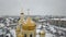 Aerial view of the golden dome of the church, close-up, in the Ukrainian town of Emilcheno