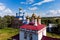 Aerial view of the golden domes of ancient Orthodox churches in the village of Trubino, Russia