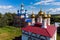 Aerial view of the golden domes of ancient Orthodox churches in the village of Trubino, Russia