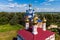 Aerial view of the golden domes of ancient Orthodox churches in the village of Trubino, Russia