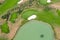 Aerial view of golf course. Drone or helicopter view of green field sand bunker and water hazard