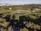 Aerial view of the golf court with a small lake in the field, view of the country sport club in Cruz Quebrada-Dafundo, Lisbon,