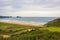 Aerial view of golf field and coast of Bay of Biscay, Basque country. Scenic surf beach and golf field, top view.