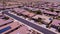 Aerial view of Goodyear, Arizona city with clean asphalt roads, low buildings and green trees
