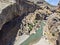 Aerial view of the gorge with prehistoric caves over the the wide and almost dry river bed. Cendere stream. Turkey