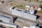 An aerial view of granaries and a rail siding.