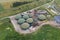 Aerial view of green biogas plant storage tanks