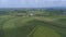 Aerial View of Green Farmlands With Different Crops Growing in the Fields