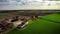 Aerial view of green field and road in Po Valley, Italy