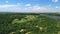 Aerial view: green forest in the floodplain of the river, beautiful landscape