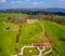 Aerial view of the green golf course. Target at driving Range