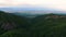 Aerial view of green hills of Caucasus mountains overlooking Alazani valley