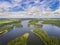 Aerial view of green islands and clouds at summer sunny day.Wydminy lake on Masuria in Poland.