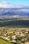 Aerial view green mountain landscape with dark clouds and villages with houses on the mountainside. Navacerrada Madrid