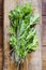 Aerial view of green organic leafy vegetable on wooden background