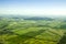 Aerial view of a green rural area under blue sky