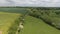 Aerial view of green rural country fields, farms, lakes