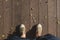 Aerial view of green sneakers canvas shoe stand on grunge old wood floor and tree shadow in sunny day, Leave space on top for add