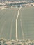 Aerial View Green Spring Field Landscape With Trails Lines