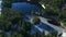 Aerial view of green trees and lake in the mountains.