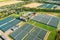 Aerial View Greenhouses For Growing Flowers, Vegetables And Fruits. Agricultural And Industrial Buildings