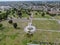 Aerial view of Greenwood Memorial Park with Memorial Statue and American flag