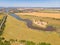 Aerial view of a grey asphalted narrow country road