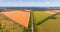 Aerial view of a grey asphalted narrow country road