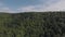 Aerial view of the grotto in the rock on top of a wooded hill