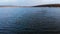 An aerial view of a group of mallard ducks swimming peacefully in a large lake. Wild ducks in vivo free nature