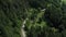 Aerial view of a group of mountain bikers with e-bikes in the swiss alps in Valais canton in sunny weather