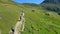 Aerial view of a group of mountain bikers with e-bikes in the swiss alps in Valais canton in sunny weather