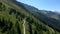 Aerial view of a group of mountain bikers with e-bikes in the swiss alps in Valais canton in sunny weather