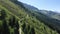 Aerial view of a group of mountain bikers with e-bikes in the swiss alps in Valais canton in sunny weather