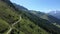 Aerial view of a group of mountain bikers with e-bikes in the swiss alps in Valais canton in sunny weather