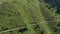 Aerial view of a group of mountain bikers with e-bikes in the swiss alps in Valais canton in sunny weather