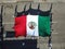 Aerial view of a group of people holding national flags of Mexico