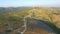 Aerial view of group of windmills on a hill path