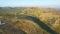 Aerial view of group of windmills on a hill path