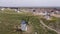 Aerial view of a group of windmills and residential neighborhoods in the city of Campo de Criptana, Spain.