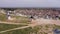 Aerial view of a group of windmills and residential neighborhoods in the city of Campo de Criptana, Spain.