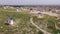 Aerial view of a group of windmills and residential neighborhoods in the city of Campo de Criptana, Spain.