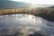 Aerial view of gudron toxic tar waste pits during winter season, afternoon sun.