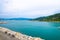 Aerial view of Gulf of Spezia turquoise water, Portovenere town stone promenade quay, Palmaria island